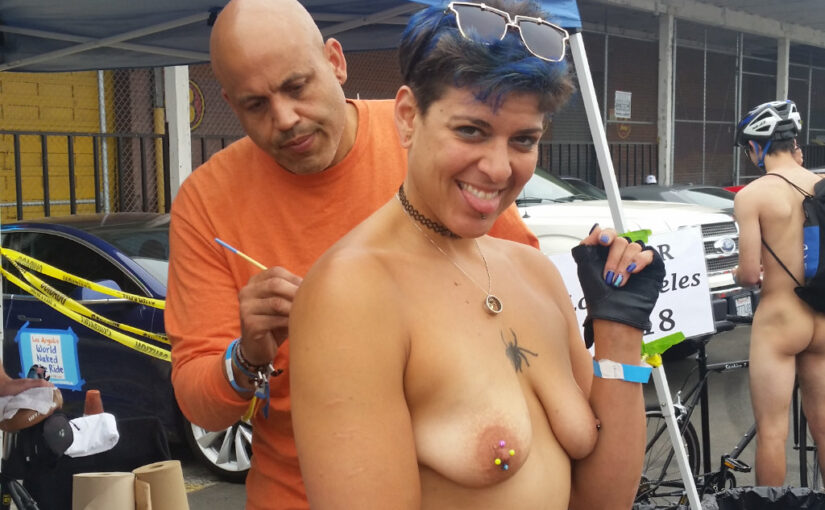 getting body painted at the world naked bike ride in Los Angeles